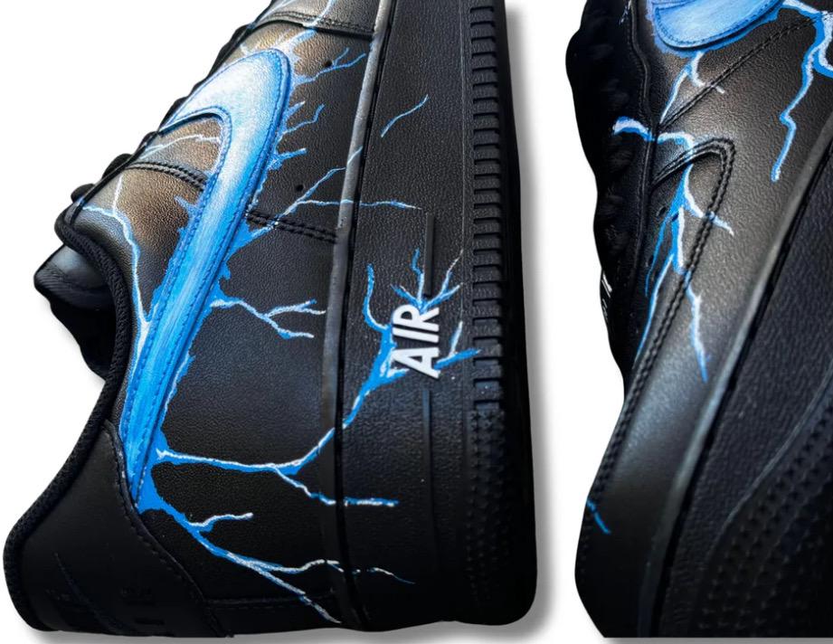 Black Air Force 1 sneakers with custom blue lightning bolts, handmade