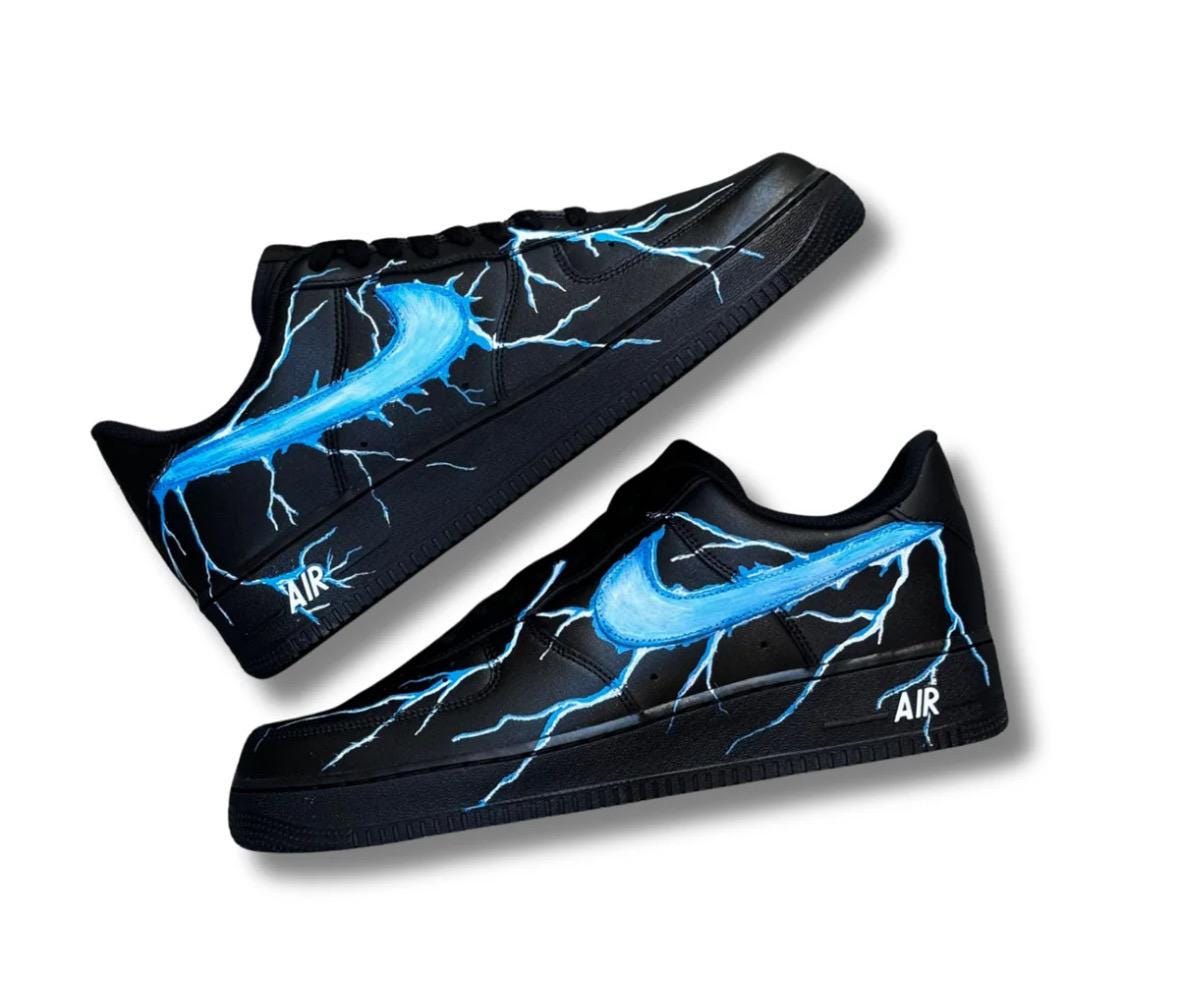 Black Air Force 1 sneakers with custom blue lightning bolts, handmade