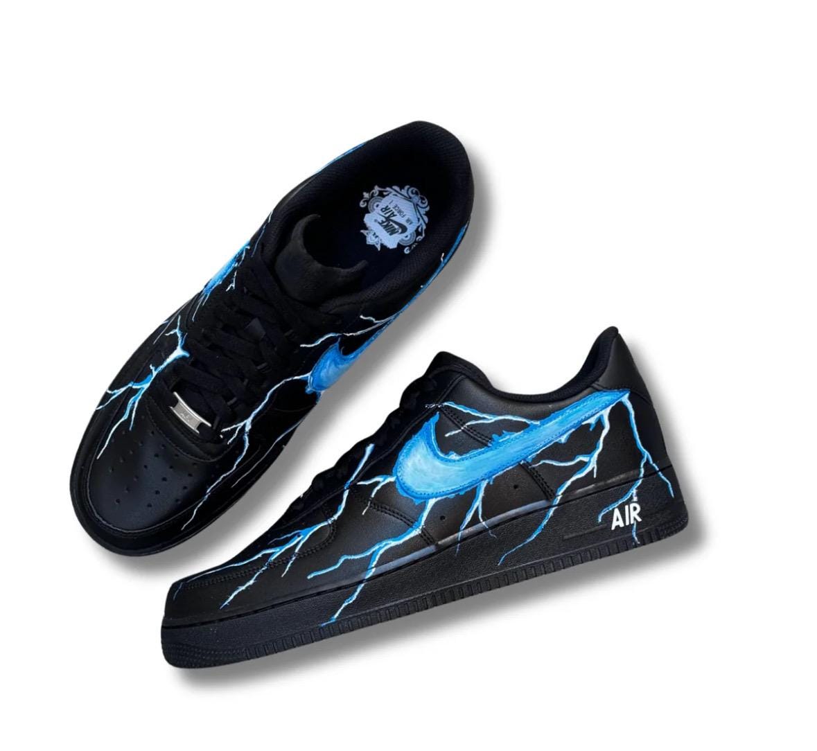 Black Air Force 1 sneakers with custom blue lightning bolts, handmade