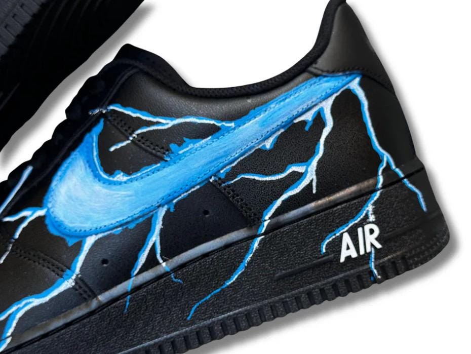 Black Air Force 1 sneakers with custom blue lightning bolts, handmade